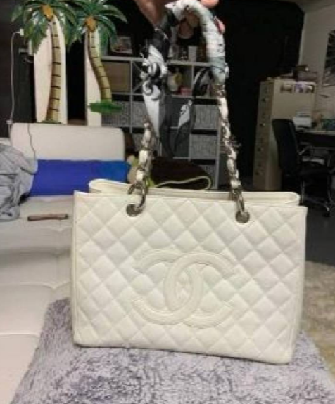 White Chanel-branded quilted tote with large CC front motif and shoulder handles