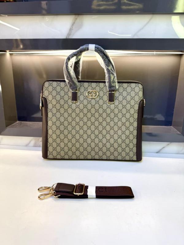Gucci beige GG pattern top handle briefcase with dark trim and gold logo emblem