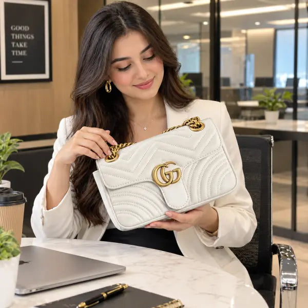 White Gucci-branded GG quilted flap chain handbag