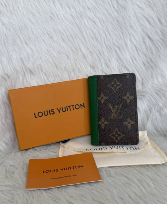 Brown Louis Vuitton monogram green trim cardholder displayed with branded box and pouch